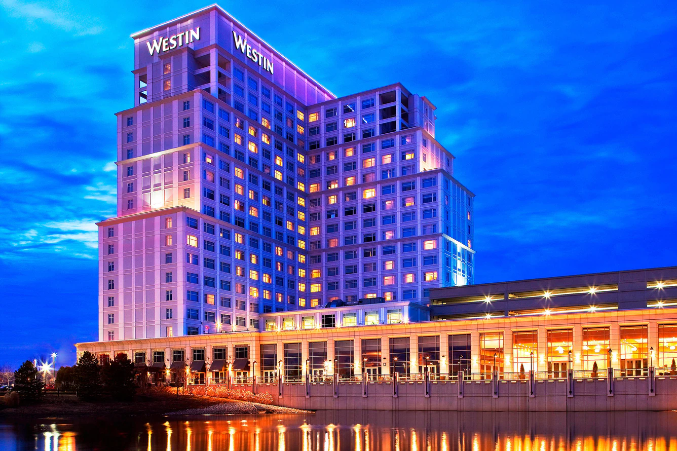 The Westin Lombard hotel exterior at sunset with reflecting pond